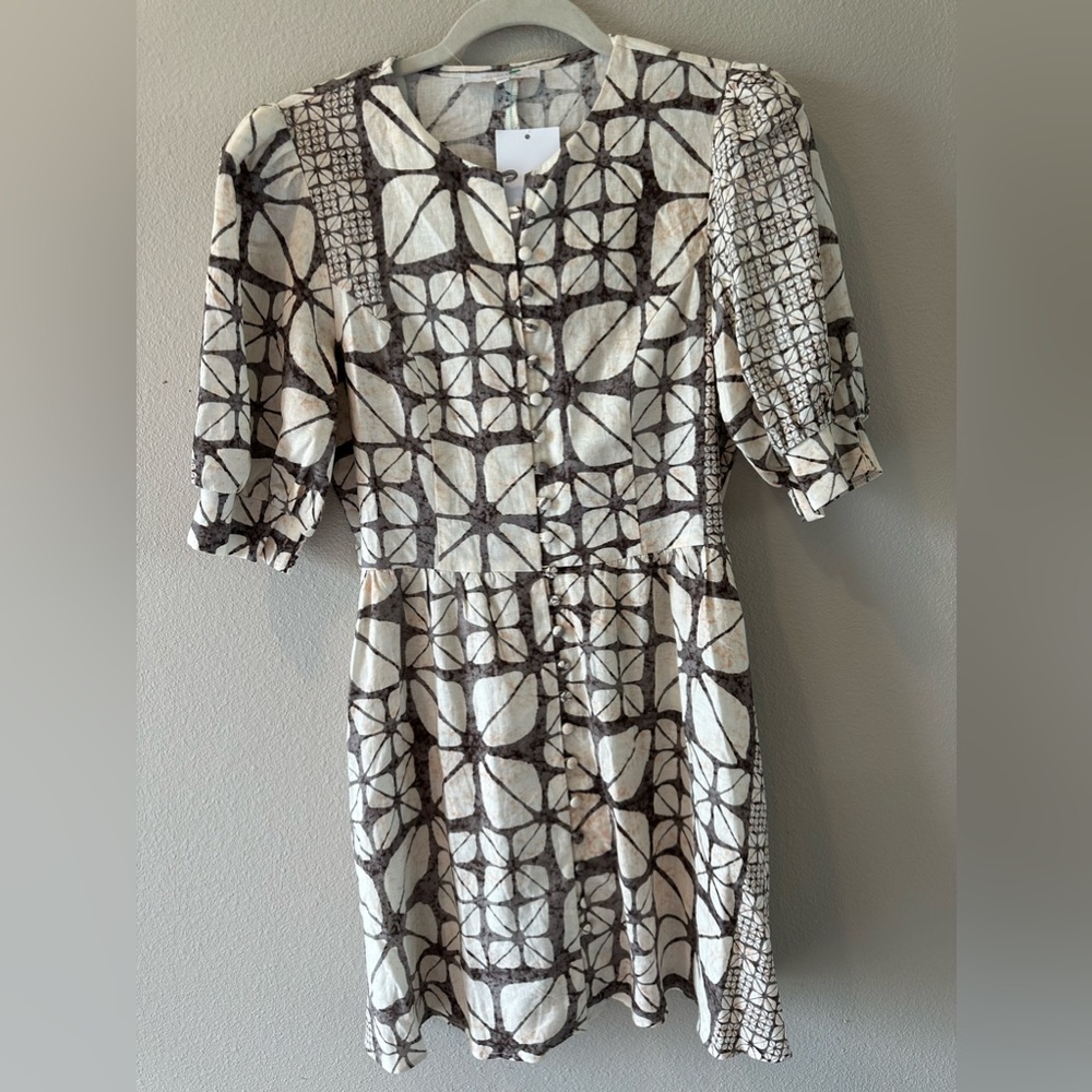 Women size large dress in ivory , beige with geometric designs. 3/4 sleeves. NWT